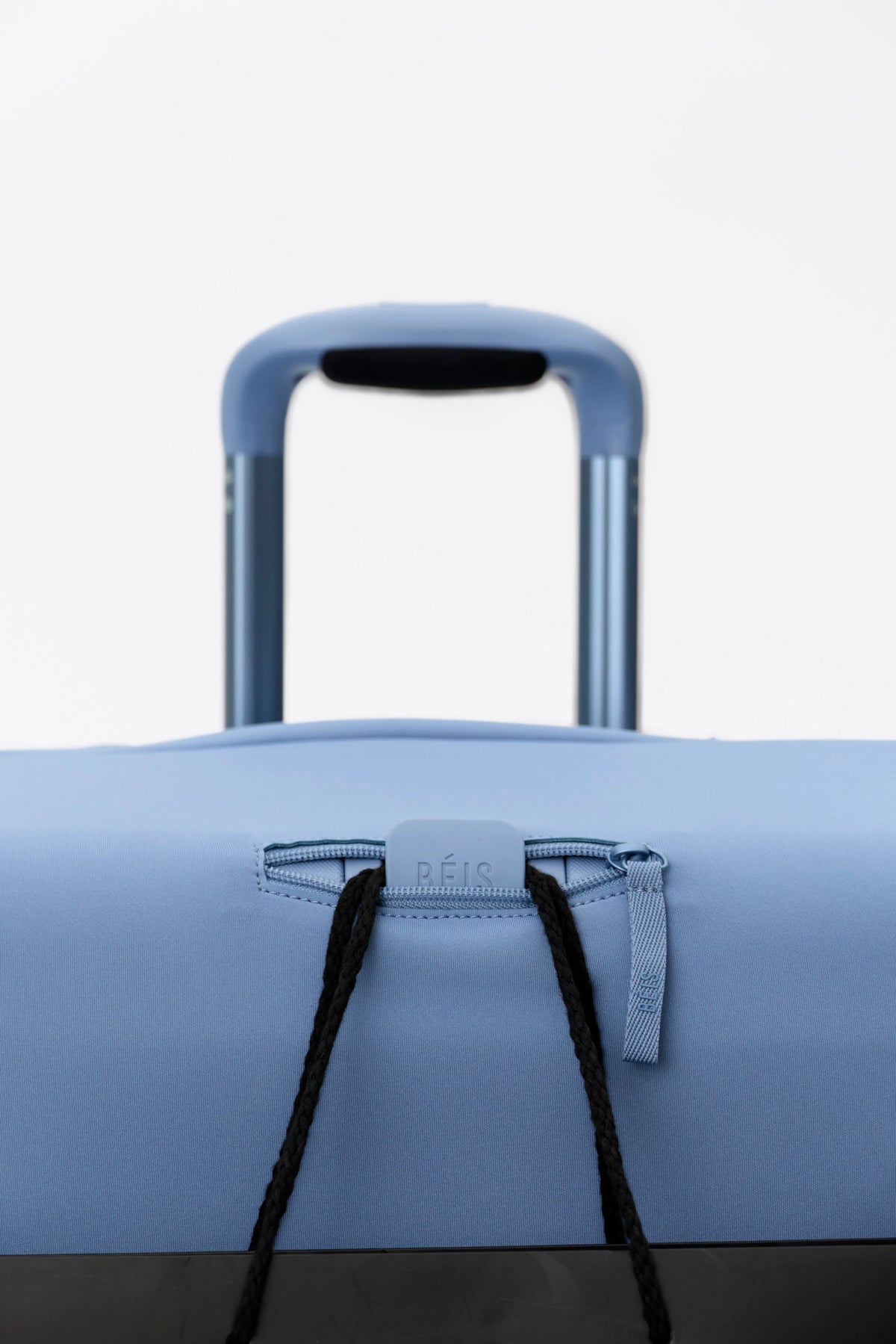The Hybrid Check-In Luggage Cover in Dusty Blue